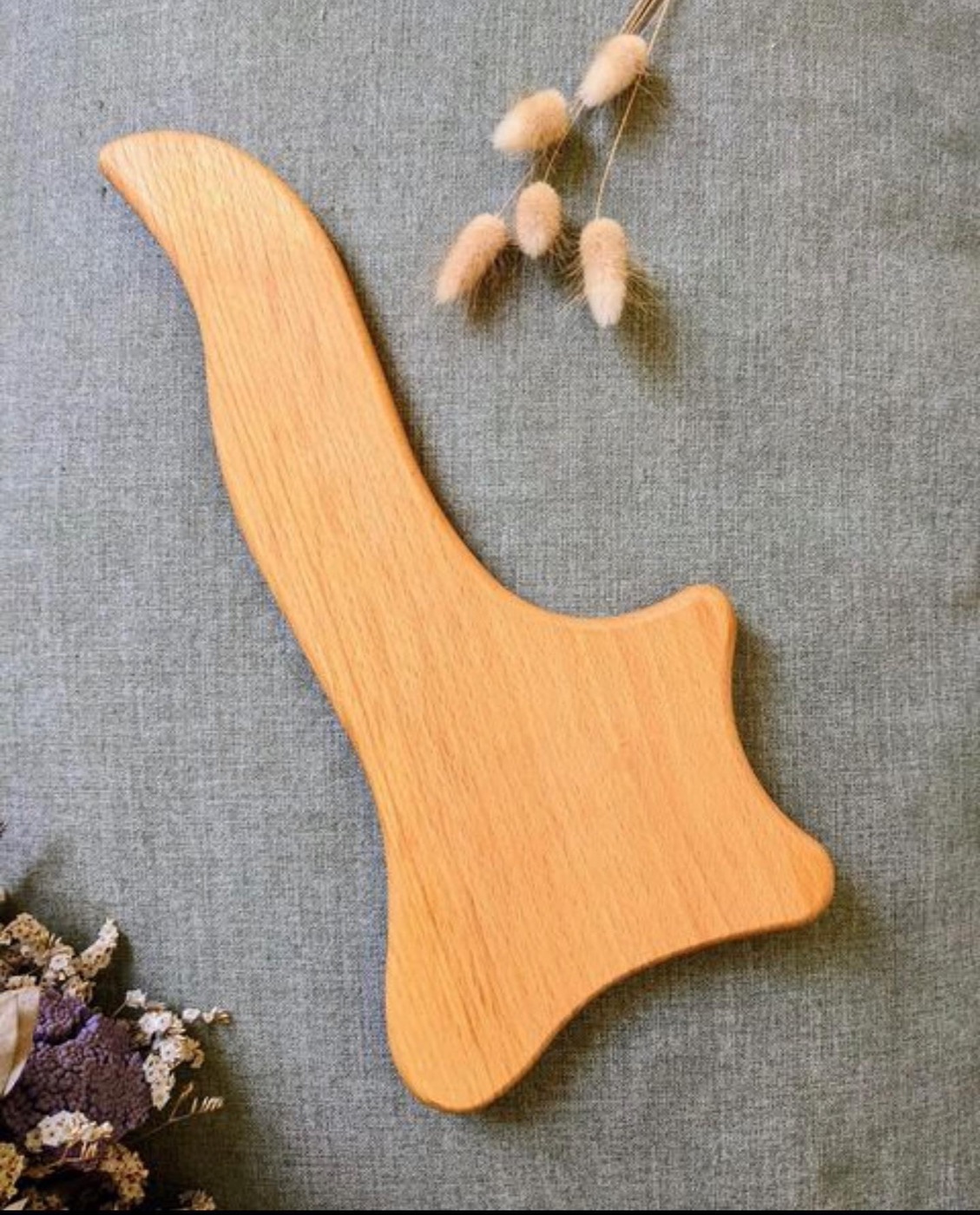 Strumento in legno per massaggio